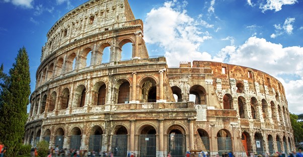 visitors tour the colosseum ruins in rome