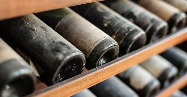 some of Italy's finest wine vintages sit in a wine rack