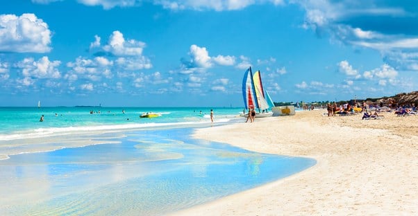 families explore and enjoy the sunny beaches of cuba