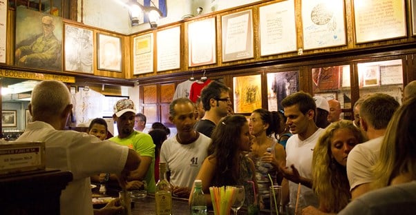 patrons crowd a Havana bar