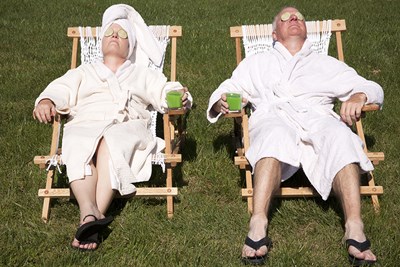 a man and a woman relax in the sun and enjoy their retirement