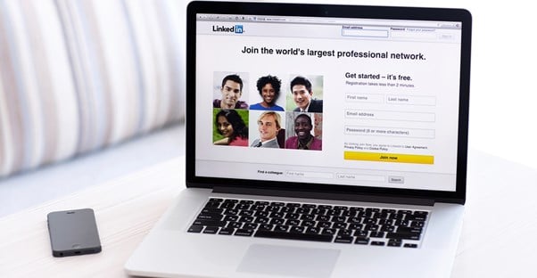 LinkedIn is pulled up on a laptop