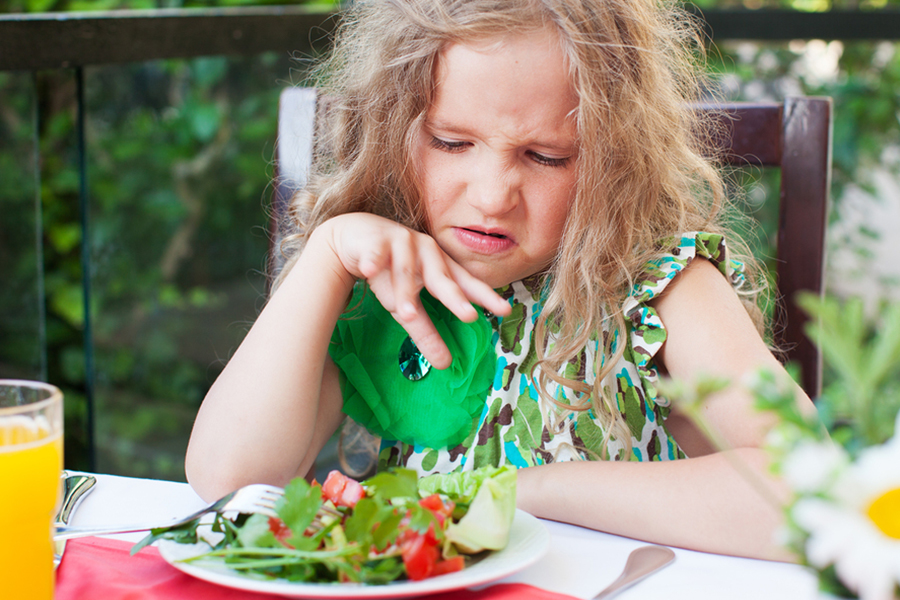 Refusing to eat green vegetables.