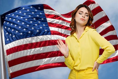 smug woman in front of flag