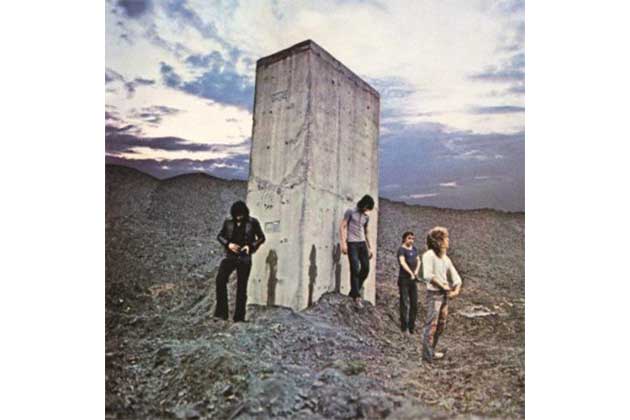 Guys Standing Around a Concrete Slab