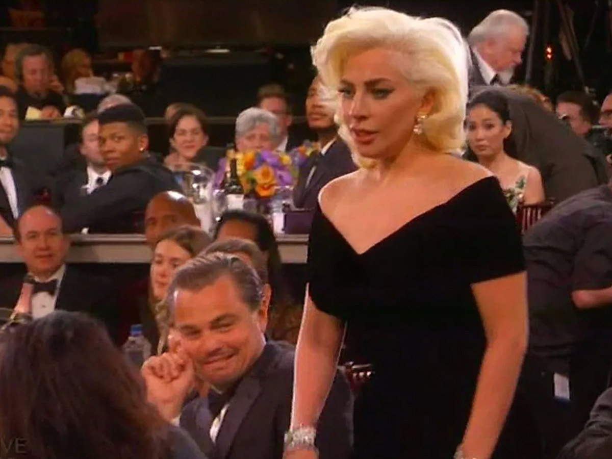 Leonardo DiCaprio makes a face at Lady Gaga