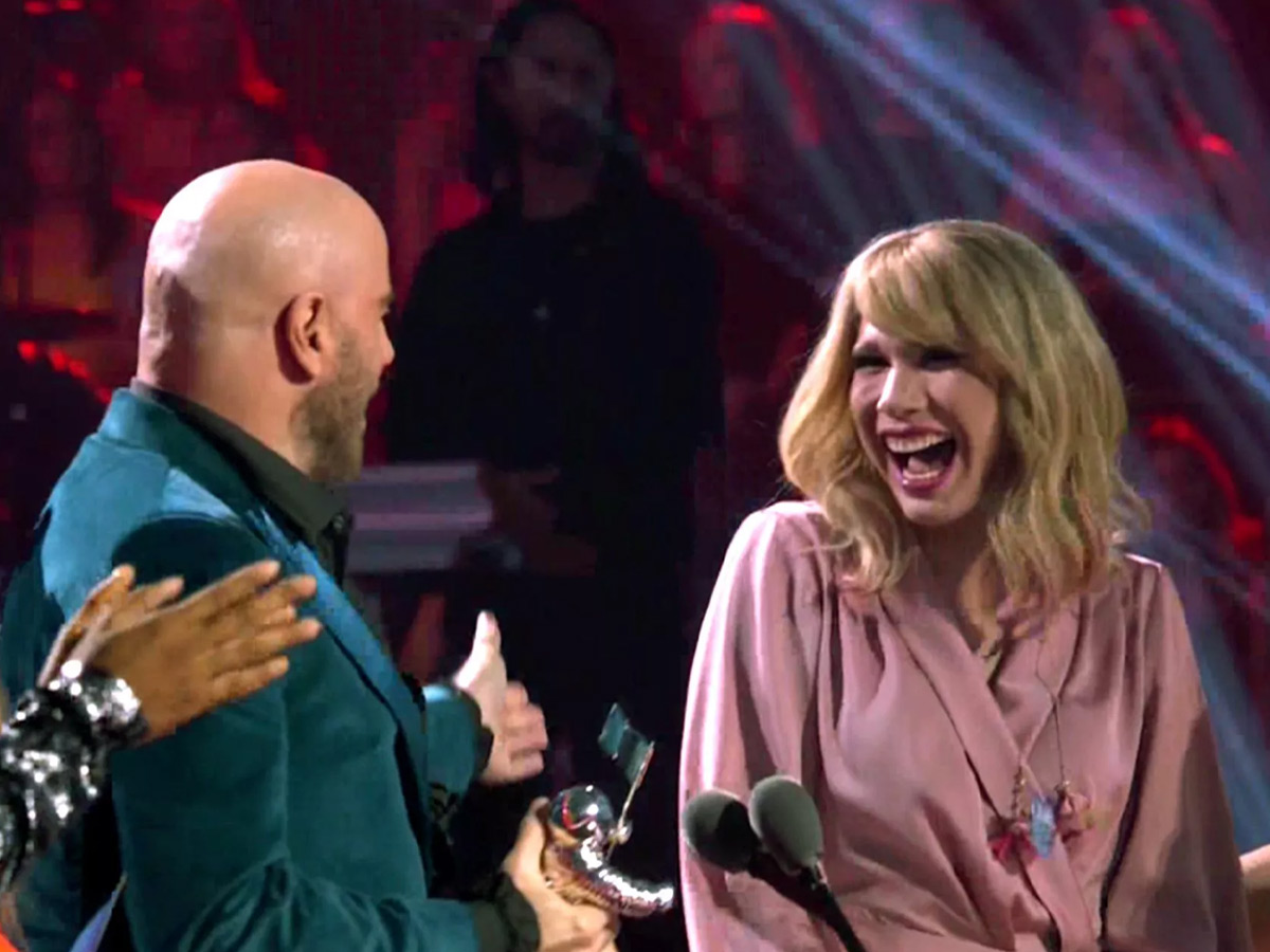 John Travolta almost gave Taylor Swift’s award to an impersonator