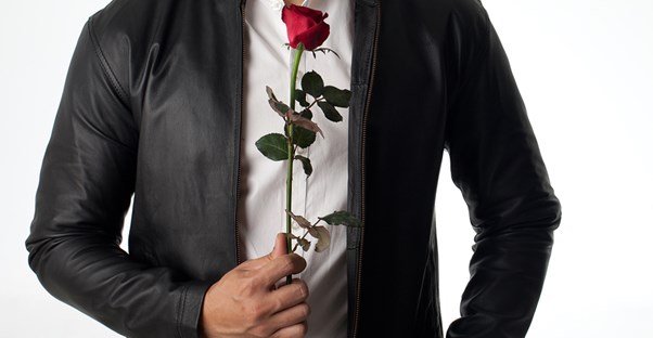 A bachelor with a red rose.