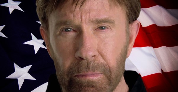 Chuck Norris in front of the American flag.