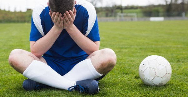A boy crying soccer tears