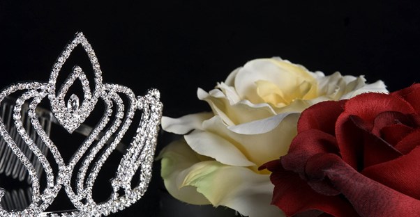 A beauty pageant crown and roses