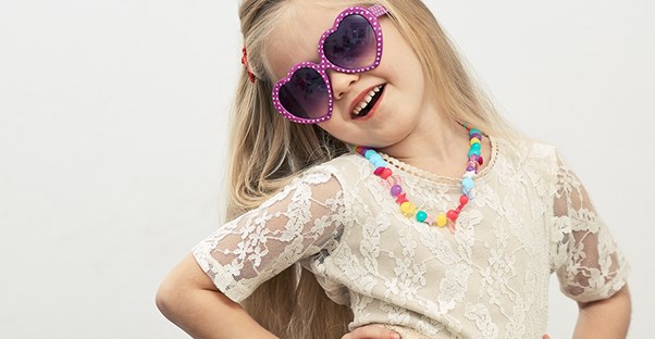 Girl posing with sunglasses on