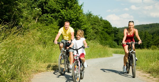 Family riding bikes for a weekend activity