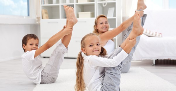 kids getting off the couch to exercise with their mother