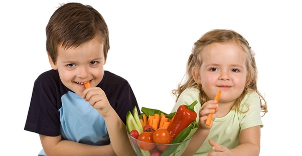 A brother and sister eat healthy, immune boosting snacks.