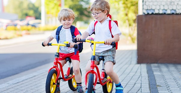 Two brothers riding bikes