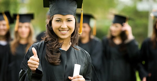 Woman graduating from a social work online degree program