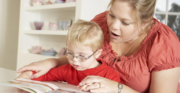 A speech pathologist works with a young child