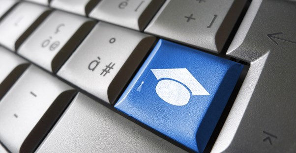 Blue graduate button on a keyboard