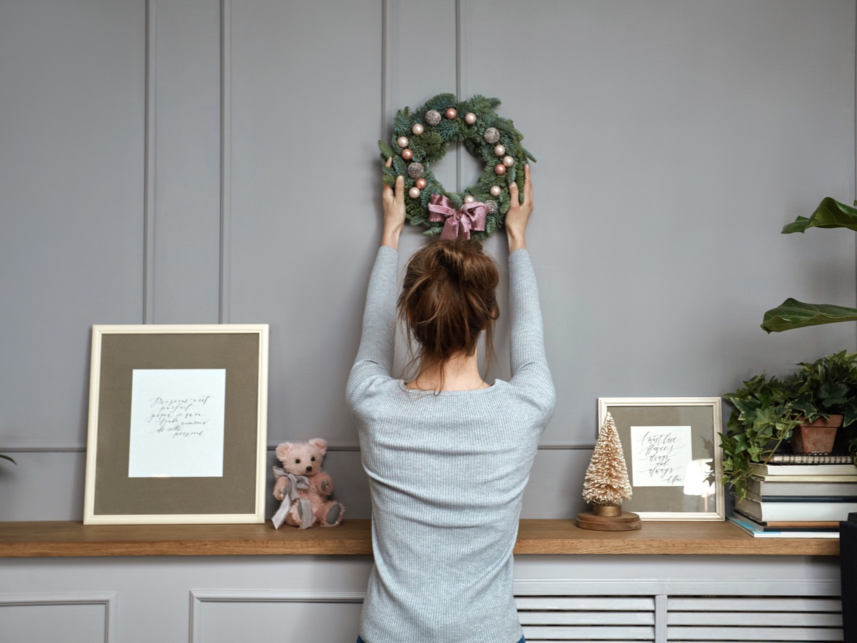 Add one Christmas decoration to each wall. 