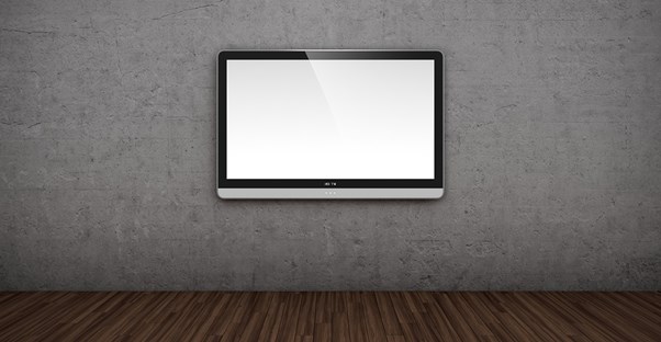 A flatscreen tv mounted on a blank wall