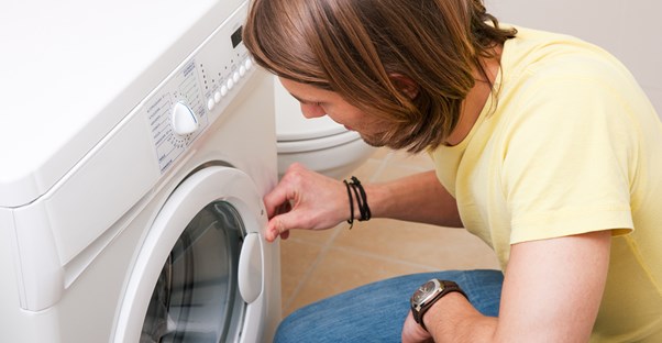 Man tests a recently repair washing machine