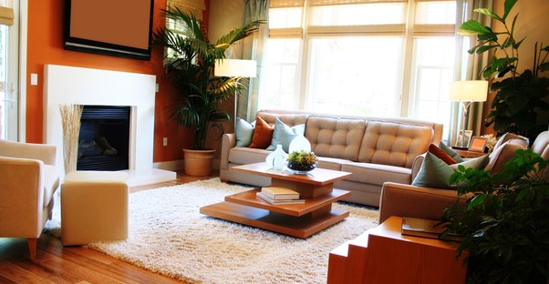 A living room with a well placed area rug