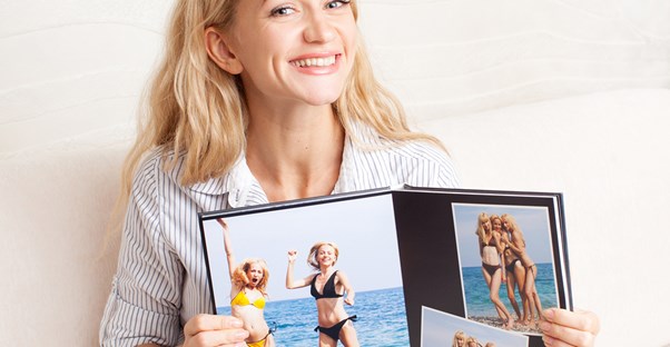 Woman showing off the theme of her photo book