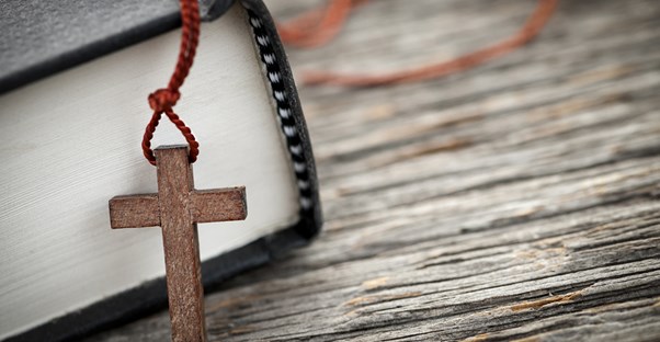 A bible and cross being used during Lenten season.