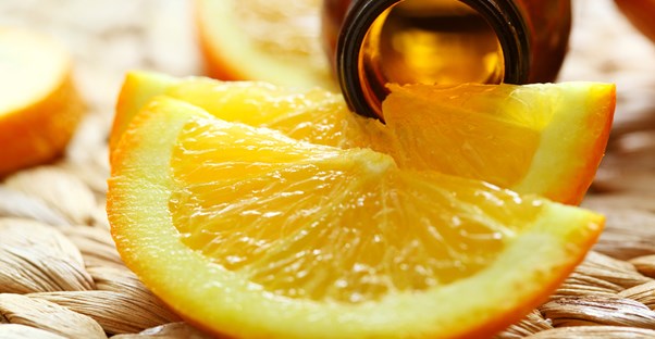 Essential oils and orange wedges