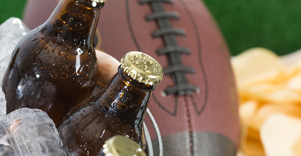 A football and beer at a tailgate
