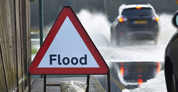 flood sign on side of the road
