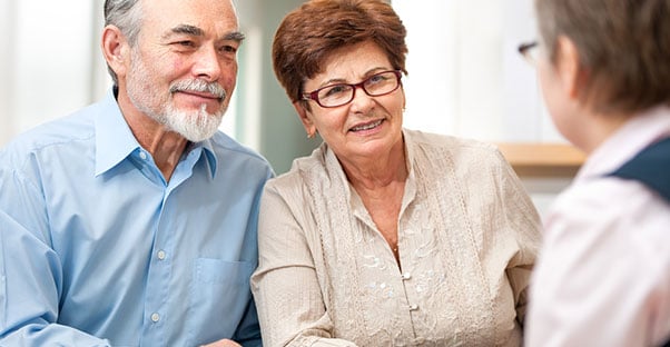 Older couple consulting with a life insurance agent