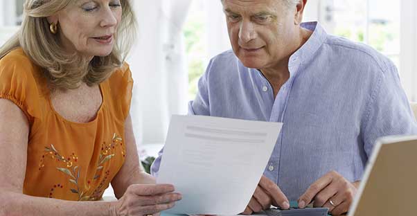 An older couple reviewing their life insurance options