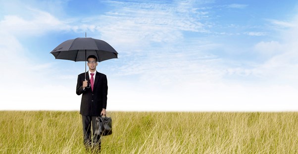 Man In Field With Umbrella