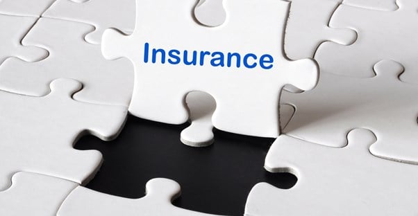 Puzzle piece standing up that says insurance