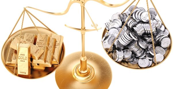 Scale weighing gold and silver for investments