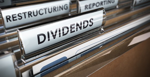 File folder tabs labeled dividends, restructuring, reporting