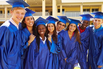 A group of high school graduates pose for a picture