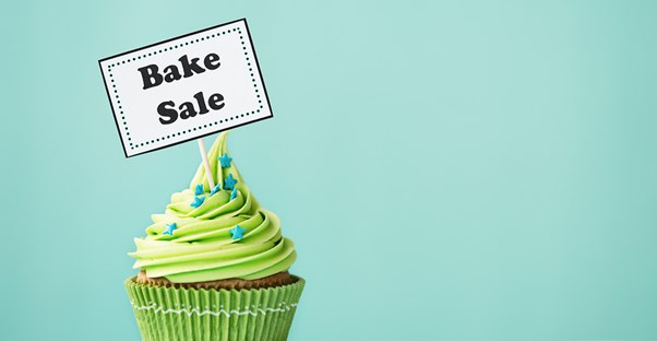 Cupcake with a bake sale sign