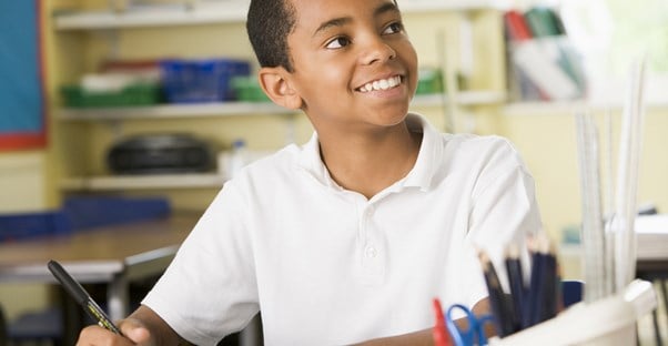 A child attends school in a school uniform