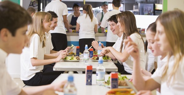 Students eat lunch in the cafeteria