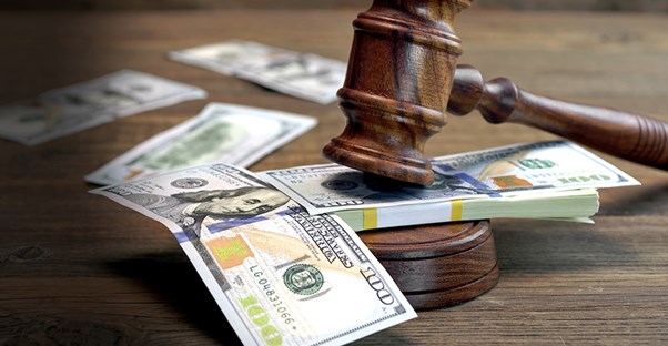 gavel on top of money in court room
