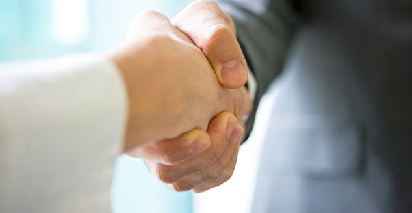 Shaking hands after signing power of attorney