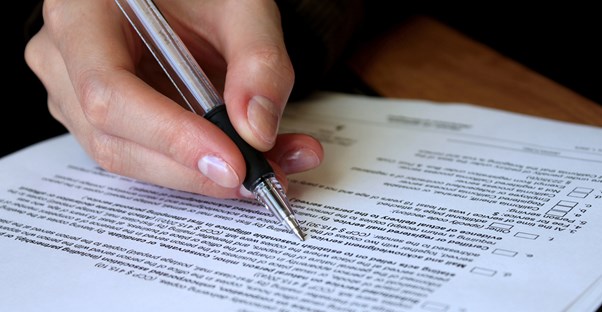 Person filling out legal forms