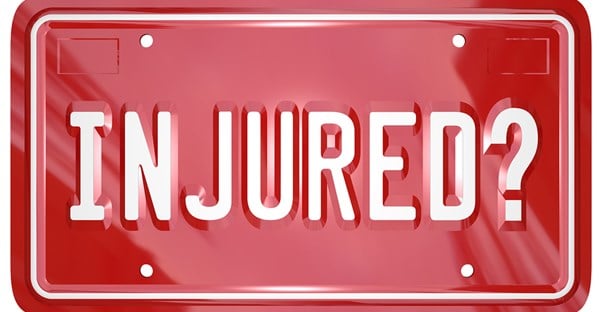 A red license plate that says Injured? 