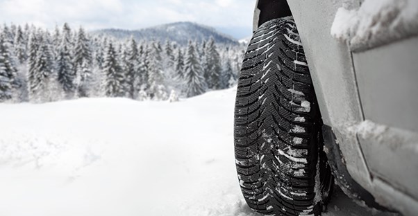 car tire driving in snow