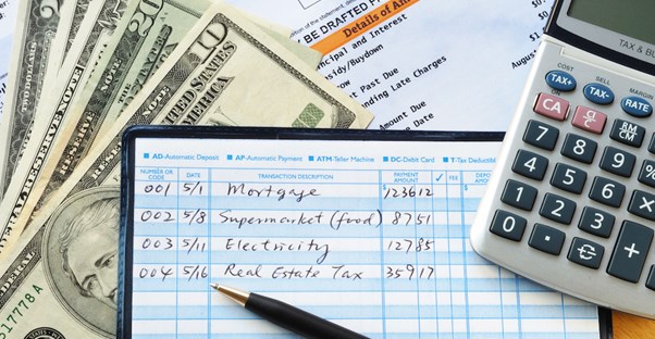 Cash, checkbook register, and calculator