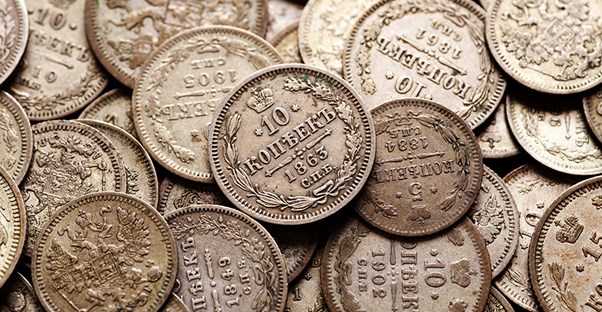 a pile of antique rare coins