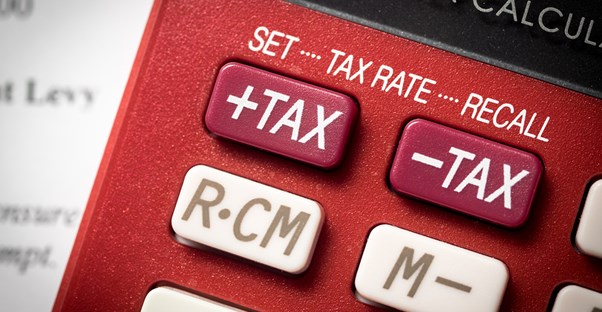 A close up of a calculator being used to calculate child tax credit.